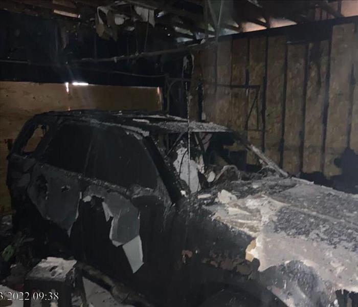 Car in Garage Covered in Soot